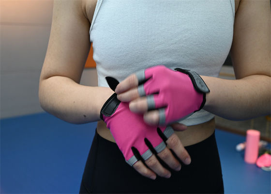 Pink lightweight half-finger workout gloves offer comfort and grip during weightlifting sessions.